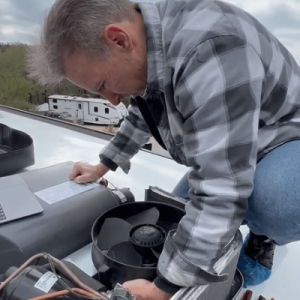 RV Technician working on Air Conditioner